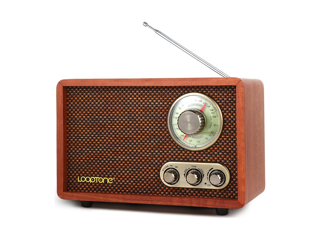 A retro-style wooden AM/FM radio with a tuning dial and three control knobs, photographed on white